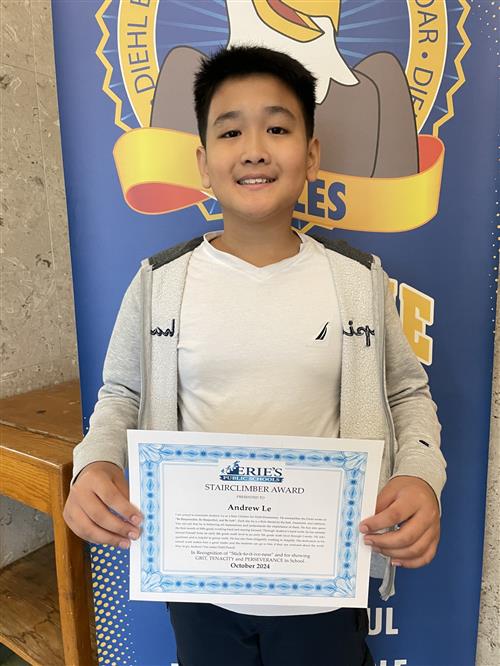 Diehl's October Stairclimber, Andrew Le, poses with his certificate.